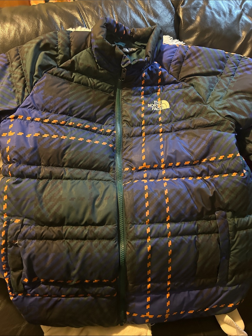 The North Face Navy Puffer Jacket with Orange Plaid Accents